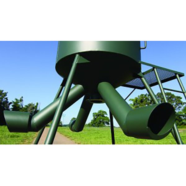 A green metal wildlife feeder with multiple tubes for game feeding, set against an outdoor background.