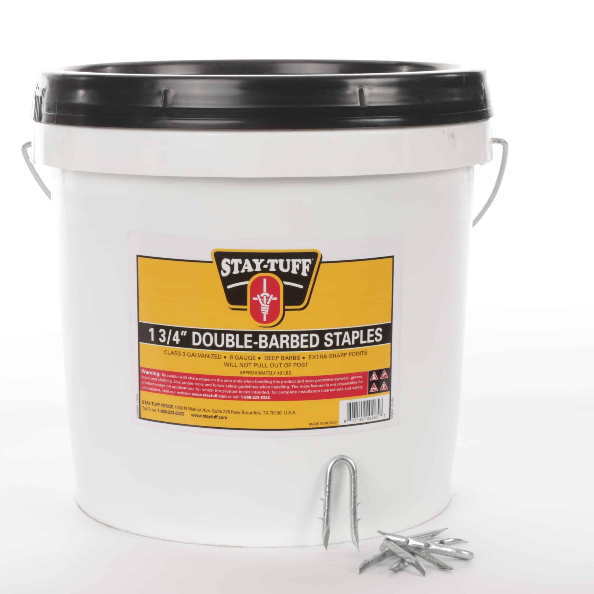 A white container with a black lid labeled 'Stay-Tuff 1 3/4" Double-Barbed Staples', containing barbed staples used for fencing.