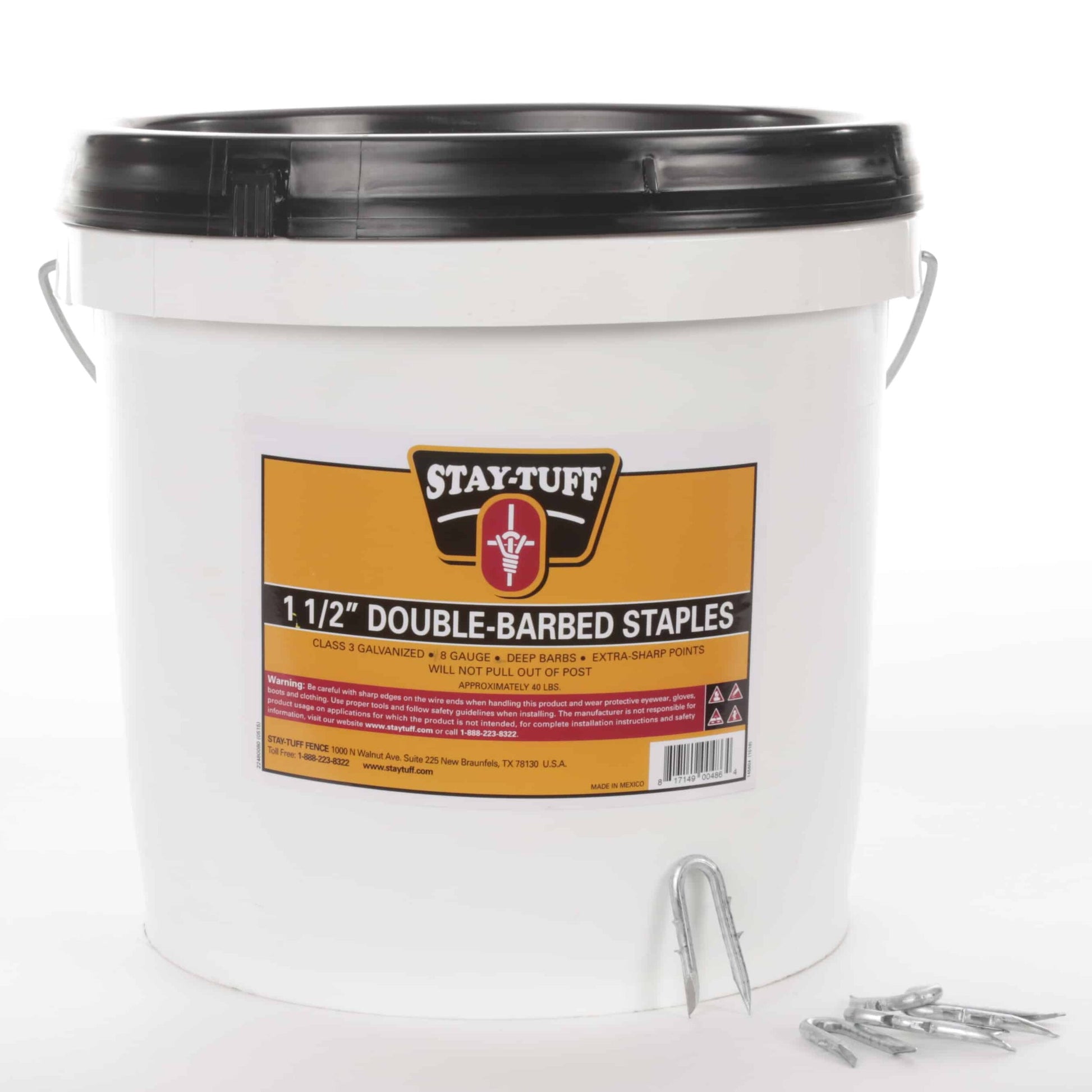 A white container with a black lid labeled 'Stay-Tuff 1 1/2" Double-Barbed Staples', containing barbed staples used for fencing.
