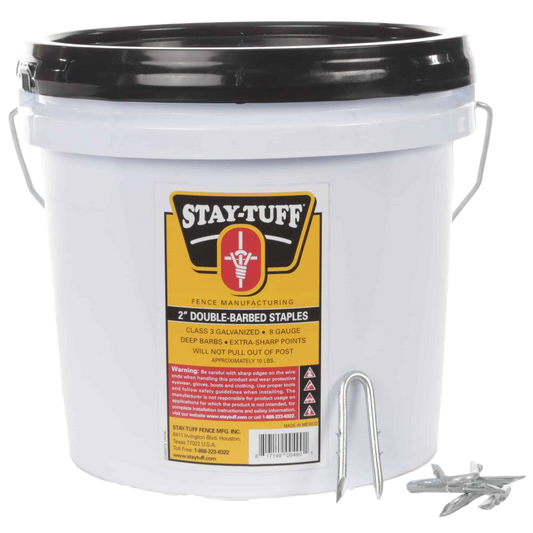 A white container with a black lid labeled 'STAY-TUFF' filled with barbed staples for fencing.