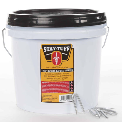 A white container with a black lid labeled 'STAY-TUFF' filled with barbed staples for fencing.