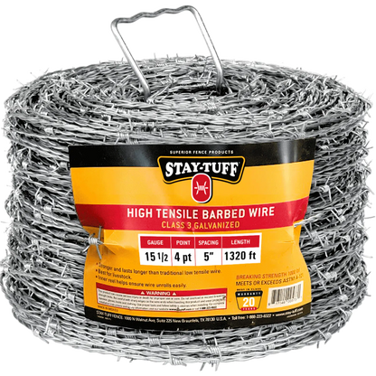 A spool of high tensile barbed wire, coiled and supported by metal holders.