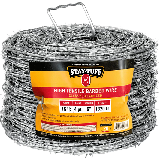 A spool of high tensile barbed wire, coiled and supported by metal holders.